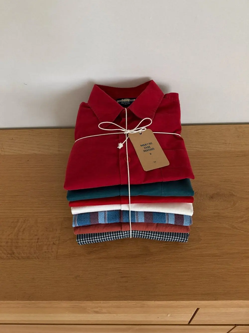 Folded ironed shirts tied with string