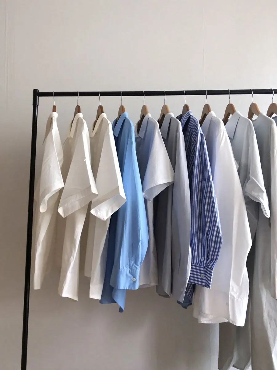 Pressed shirts on wooden hangers